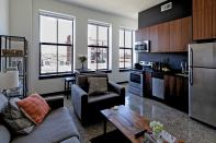The units at Parkway 301 feature sustainably sourced walnut cabinets, paper-resin countertops, and Energy Star appliances and fixtures.