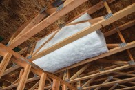 The JM Formaldehyde-free Cavity-SHIELD fiberglass batt, shown here installed in a floor space cavity.