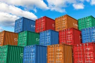 Stacked cargo containers in storage area of freight sea port terminal