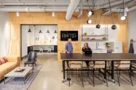 Rafter, a luxury multifamily community in Northeast Minneapolis, features an entire floor of several interconnected amenity zones, including a clubroom and a makers room.