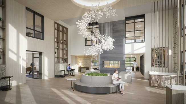 The lounge-like lobby Morgante Wilson Architects designed for Lumen Fox Valley features double-height ceilings and a variety of seating areas, including a circular banquette.