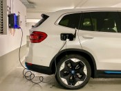 A car charging at a charging station