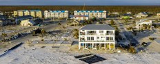 A building with a roof and a beach