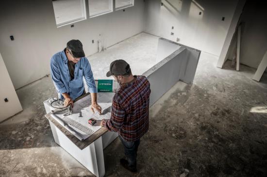 a man installing a faucet