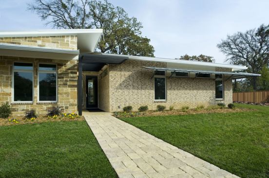 GreenCraft Builders, LLC  Lewisville, Texas This home’s net-zero energy design--including passive solar features and a 9-kW photovoltaic system--has been producing a utility credit since the home's occupancy early last year. Constructed using advanced framing techniques, the structure is insulated with R-21 open-cell foam with R-5 foam sheathing.