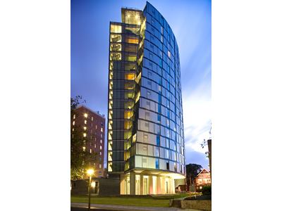 Millennium Hall is a suitable name for Drexel’s newest dormitory. Eighteen stories high, Millennium Hall is laterally off-set at every floor to create a spiraling effect and give the structure a visible lean. Every floor has a student lounge equipped with a flat-screen television, comfortable seating for social interaction, and floor-to-ceiling windows for great views of the city. The top floor provides a panoramic view of the Philadelphia skyline. Meanwhile, the roof was designed to reduce storm-water runoff, diminish the heat-island effect, and provide solar shading. It’s the farthest dormitory from central campus, though still only a short walk, but well worth it for the building’s stirring architecture and comfortable living arrangements. Millennium Hall received an
Award of Merit from the Delaware Valley Association of Structural Engineers.