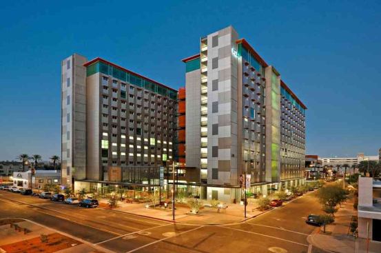 Centrally located to all academic buildings, Taylor Place at Arizona State University offers students modern units in the heart of downtown Phoenix. Rooms come fully furnished with extra-long twin mattresses, desks, and chairs. High-speed internet is provided, and utility costs are included. There is an in-hall fitness center, dining room, and retail store, and designated study areas are located on every other floor. The contemporary exterior allows plenty of natural light into the building’s interior spaces. Proximity to both the campus and the city make Taylor Place ideal for upper-class students.