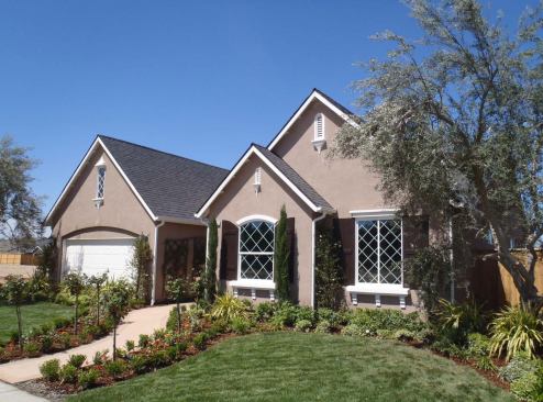 Wathen-Castanos Hybrid Homes  Clovis, Calif. This 1,985-square-foot home features a 3.7-kW photovoltaic system, a 19-SEER air conditioner, a 0.98 EF tankless gas water heater, and an innovative ventilation design with supply vents at interior walls and all ducts insulated to R-8 and located outside the thermal envelope. The production builder, named the 2011 EVHA Builder of the Year, was lauded by the judges for building high-efficiency, competitively priced homes.